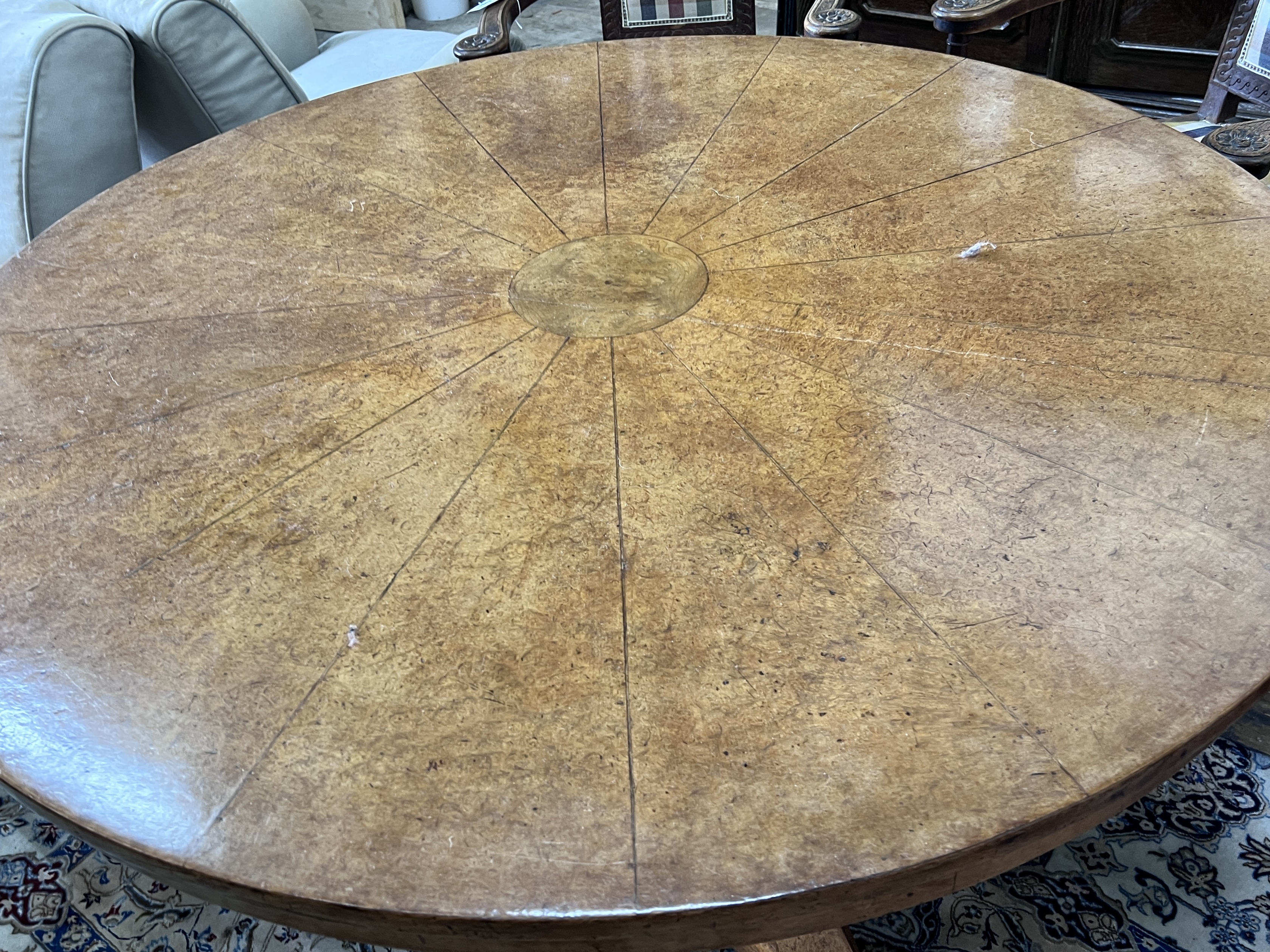 An early Victorian circular bird's eye maple circular breakfast table, with a segmented veneered top, diameter 128cm, height 74cm